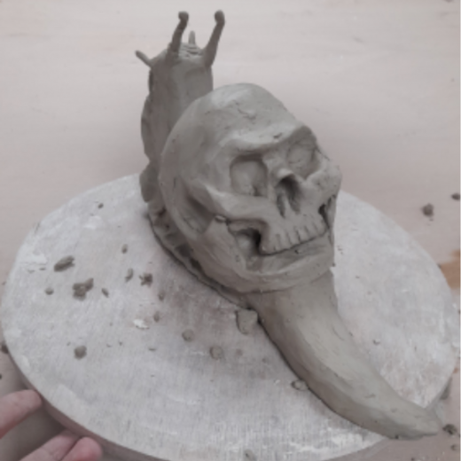This piece is a current work in progress for my project titled 'Beautiful Decay', its is a sculpture of a snail with a skull as its shell and mushrooms growing from it.
